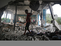 Palestinians are checking a UN-school that was hit during Israeli bombardment in Nuseirat, in the central Gaza Strip, on June 6, 2024, amid...