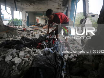 Palestinians are checking a UN-school that was hit during Israeli bombardment in Nuseirat, in the central Gaza Strip, on June 6, 2024, amid...