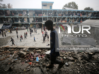 Palestinians are checking a UN-school that was hit during Israeli bombardment in Nuseirat, in the central Gaza Strip, on June 6, 2024, amid...