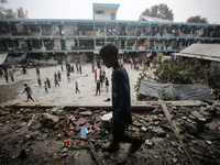 Palestinians are checking a UN-school that was hit during Israeli bombardment in Nuseirat, in the central Gaza Strip, on June 6, 2024, amid...