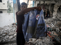 Palestinians are checking a UN-school that was hit during Israeli bombardment in Nuseirat, in the central Gaza Strip, on June 6, 2024, amid...