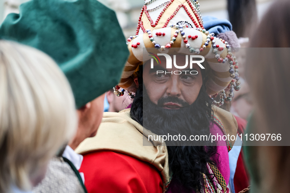 Lajkonik, a folklore symbol of Krakow, walks in a parade during the Lajkonik March in the Old Town of Krakow, Poland on June 6, 2024. Centur...