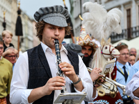 Lajkonik parade members walk in the Old Town of Krakow, Poland on June 6, 2024. Centuries long tradition of Lajkonik, a bearded man on a woo...