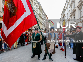 Lajkonik parade members walk in the Old Town of Krakow, Poland on June 6, 2024. Centuries long tradition of Lajkonik, a bearded man on a woo...