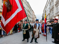 Lajkonik parade members walk in the Old Town of Krakow, Poland on June 6, 2024. Centuries long tradition of Lajkonik, a bearded man on a woo...