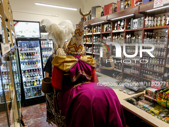 Lajkonik, a folklore symbol of Krakow, visits a shop during the Lajkonik March in the Old Town of Krakow, Poland on June 6, 2024. Centuries...