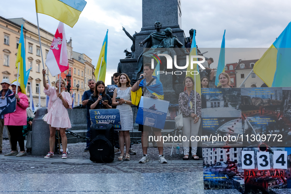 Members of Ukrainian diaspora sing during a daily demonstration of solidarity with Ukraine on the Main Square in Old Town of Krakow, Poland...