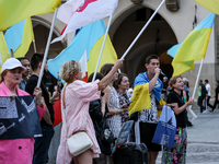 Members of Ukrainian diaspora sing during a daily demonstration of solidarity with Ukraine on the Main Square in Old Town of Krakow, Poland...