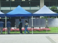 Students are learning about their test site at a college entrance examination point in Hangzhou, Zhejiang province, China, on June 7, 2024....