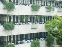 Candidates are waiting outside a test site for the National College Entrance examination in Hangzhou, China, on June 7, 2024. (