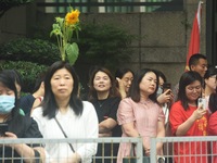 Parents are waiting outside a college entrance examination point in Hangzhou, Zhejiang province, China, on June 7, 2024. (