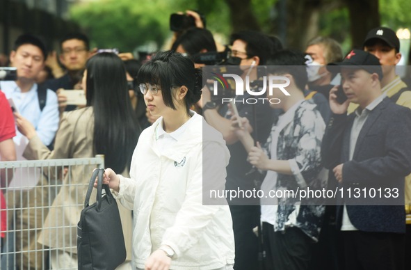 Candidates are walking into a college entrance exam in Hangzhou, Zhejiang province, China, on June 7, 2024. 