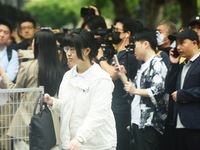 Candidates are walking into a college entrance exam in Hangzhou, Zhejiang province, China, on June 7, 2024. (