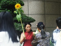 Parents are waiting outside a college entrance examination point in Hangzhou, Zhejiang province, China, on June 7, 2024. (