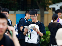 Candidates are walking into the test room for the 2024 National College entrance examination at Jinan Foreign Language School in Jinan, Chin...