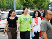 Candidates are walking into the test room for the 2024 National College entrance examination at Jinan Foreign Language School in Jinan, Chin...