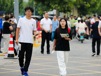 Candidates are walking into the test room for the 2024 National College entrance examination at Jinan Foreign Language School in Jinan, Chin...