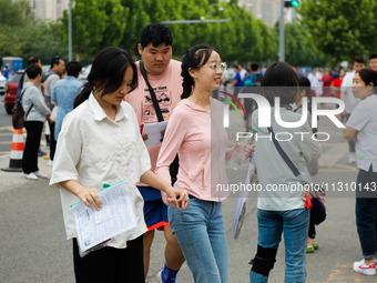 Candidates are walking into the test room for the 2024 National College entrance examination at Jinan Foreign Language School in Jinan, Chin...