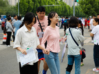 Candidates are walking into the test room for the 2024 National College entrance examination at Jinan Foreign Language School in Jinan, Chin...