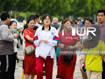 Candidates are walking into the test room for the 2024 National College entrance examination at Jinan Foreign Language School in Jinan, Chin...