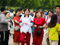 Candidates are walking into the test room for the 2024 National College entrance examination at Jinan Foreign Language School in Jinan, Chin...