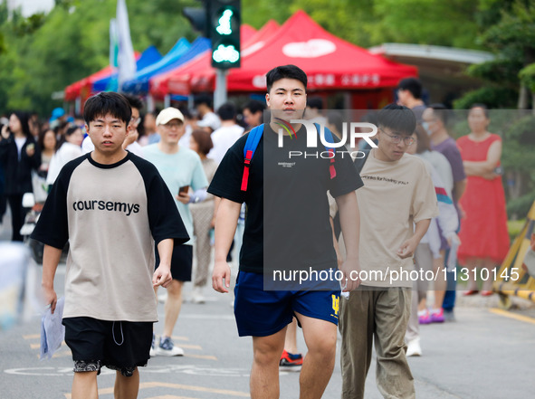 Candidates are walking into the test room for the 2024 National College entrance examination at Jinan Foreign Language School in Jinan, Chin...