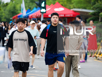 Candidates are walking into the test room for the 2024 National College entrance examination at Jinan Foreign Language School in Jinan, Chin...