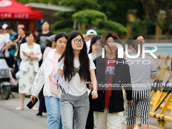 Candidates are walking into the test room for the 2024 National College entrance examination at Jinan Foreign Language School in Jinan, Chin...