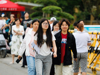 Candidates are walking into the test room for the 2024 National College entrance examination at Jinan Foreign Language School in Jinan, Chin...