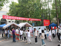 Candidates are starting to enter the test room at the entrance examination point of Nanjing Tianjiabing Senior High School in Nanjing, China...