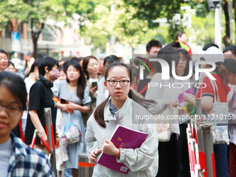 Candidates are starting to enter the test room at the entrance examination point of Nanjing Tianjiabing Senior High School in Nanjing, China...