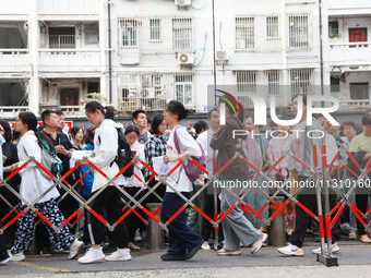 Candidates are starting to enter the test room at the entrance examination point of Nanjing Tianjiabing Senior High School in Nanjing, China...