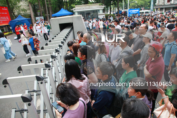 Parents are waiting outside as students are beginning to enter a gaokao test hall in Nanjing, China, on June 7, 2024. According to data rele...