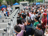 Parents are waiting outside as students are beginning to enter a gaokao test hall in Nanjing, China, on June 7, 2024. According to data rele...