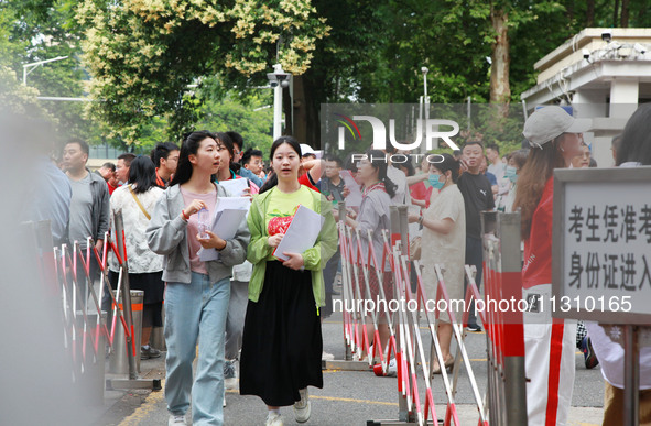 Candidates are starting to enter a college entrance examination point in Nanjing, China, on June 7, 2024. According to data released by the...