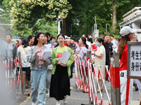 Candidates are starting to enter a college entrance examination point in Nanjing, China, on June 7, 2024. According to data released by the...