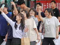 Students are posing for a group photo outside a college entrance examination point in Yantai, China, on June 7, 2024. (