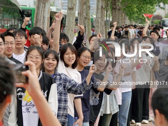 Students are posing for a group photo outside a college entrance examination point in Yantai, China, on June 7, 2024. (