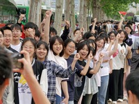 Students are posing for a group photo outside a college entrance examination point in Yantai, China, on June 7, 2024. (