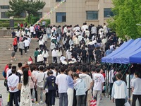 Students are walking into a test room outside a college entrance examination site in Yantai, China, on June 7, 2024. (