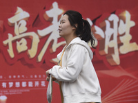 Students are walking into a test room outside Qingjiang Middle School College entrance examination site of the 2024 National College Entranc...