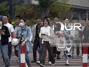 Students are walking into a test room outside Qingjiang Middle School College entrance examination site of the 2024 National College Entranc...