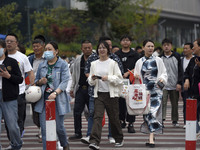 Students are walking into a test room outside Qingjiang Middle School College entrance examination site of the 2024 National College Entranc...