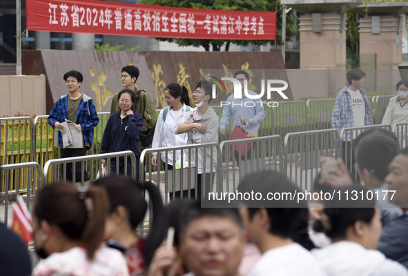 Students are walking into a test room outside Qingjiang Middle School College entrance examination site of the 2024 National College Entranc...