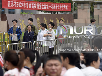 Students are walking into a test room outside Qingjiang Middle School College entrance examination site of the 2024 National College Entranc...