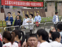 Students are walking into a test room outside Qingjiang Middle School College entrance examination site of the 2024 National College Entranc...