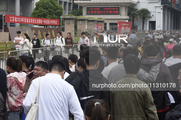 Students are walking into a test room outside Qingjiang Middle School College entrance examination site of the 2024 National College Entranc...