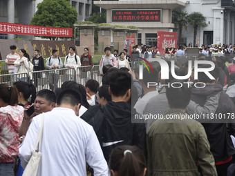 Students are walking into a test room outside Qingjiang Middle School College entrance examination site of the 2024 National College Entranc...