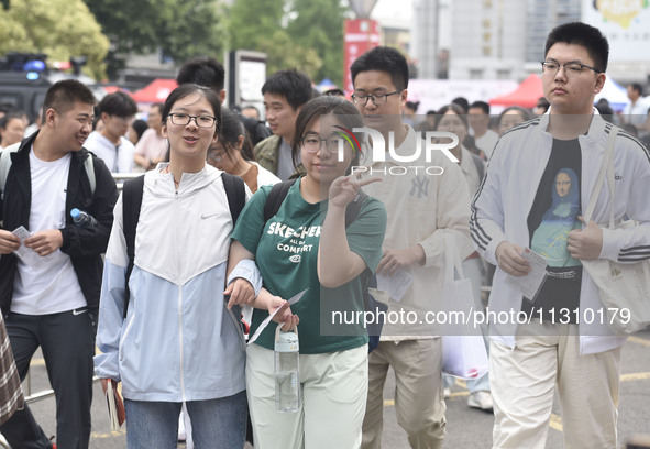 Students are walking into a test room outside Qingjiang Middle School College entrance examination site of the 2024 National College Entranc...