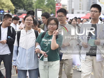 Students are walking into a test room outside Qingjiang Middle School College entrance examination site of the 2024 National College Entranc...